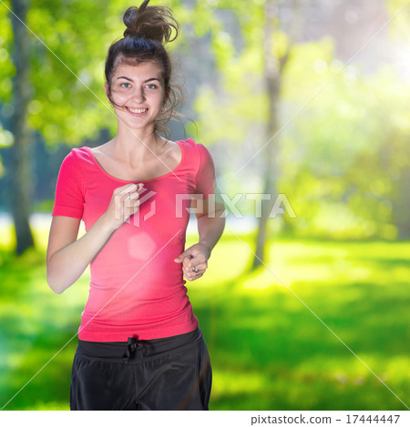 Runner - woman running outdoors in green park Runner - woman running outdoors in green park 17444447