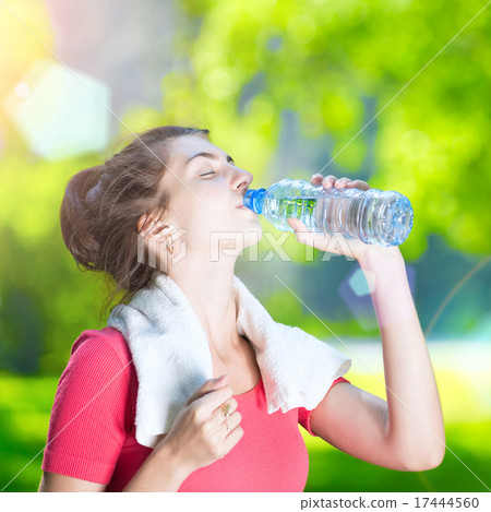 Young woman drinking water 17444560