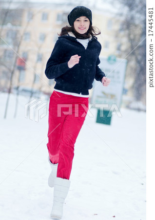 Young girl running on a cold winter day 17445481