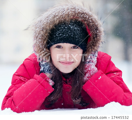 Happy young woman plays with a snow 17445532