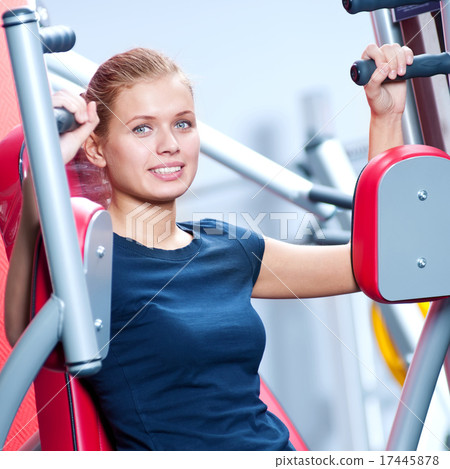 Woman at the gym exercising Woman at the gym exercising 17445878