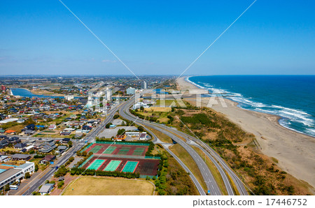 From the altitude 100 m to the aerial shot of a beautiful coastline that extends everywhere 17446752