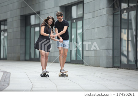 Young pair in love of stylish teenagers ride 17450261