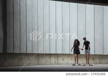 Young pair in love of stylish teenagers ride 17450266