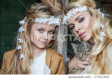 Blond woman with baby girl snuggling on wild west 17452482