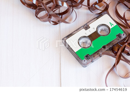 Audio cassette the wooden background 17454619