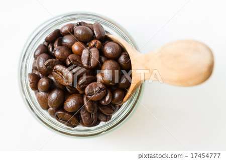 Coffee beans and an old wooden scoop Coffee beans and an old wooden scoop 17454777