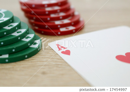 Poker game with ace of hearts and chips 17454997