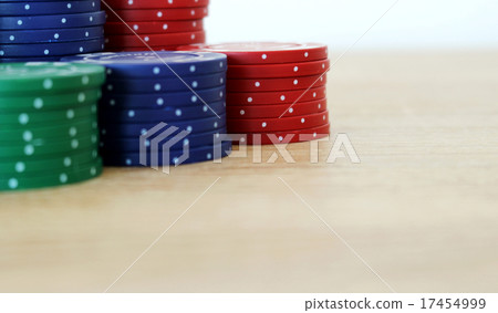 Stack of colorful poker chips on a table 17454999