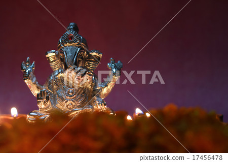 Ganesh idol shining by oil lamp, festival season Ganesh idol shining by oil lamp, festival season 17456478