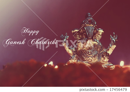 Ganesh idol shining due to oil lamp, retro effect 17456479