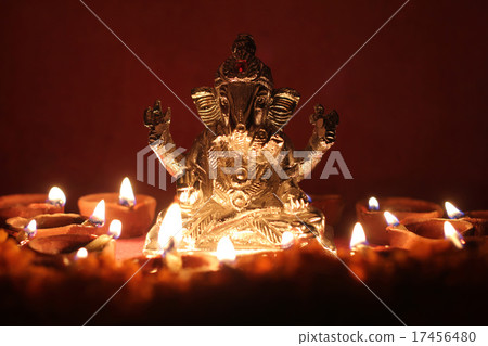 Ganesh idol  with oil lamp, festival season 17456480