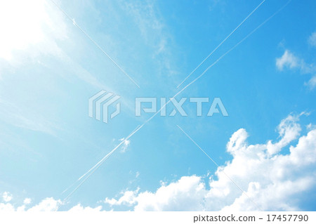 The blue sky of the early autumn and an airplane cloud extending long along the diagonal line 17457790