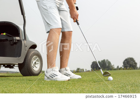 Young golfer getting ready to hit the ball Young golfer getting ready to hit the ball 17466915