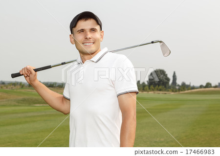 Young golf player holding a niblick Young golf player holding a niblick 17466983