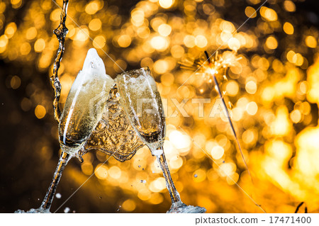 New Year's at midnight with champagne glasses New Year's at midnight with champagne glasses 17471400