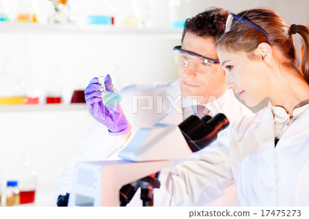 Researcher observing indikator colour shift. Researcher observing indikator colour shift. 17475273