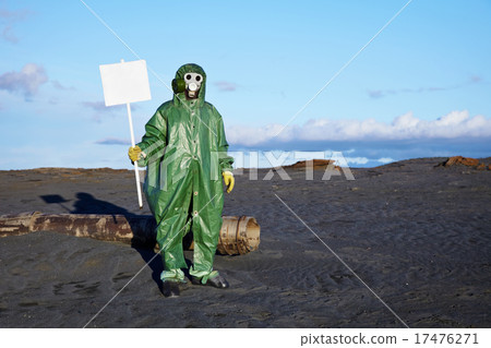 Man in overalls holding a white plate Man in overalls holding a white plate 17476271