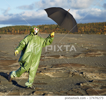 Person in protective scientific overalls with umbrella 17476273
