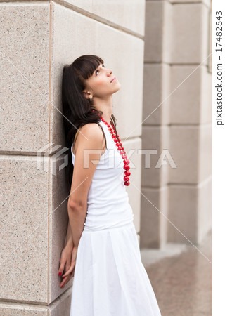 Attractive sad girl with red beads 17482843