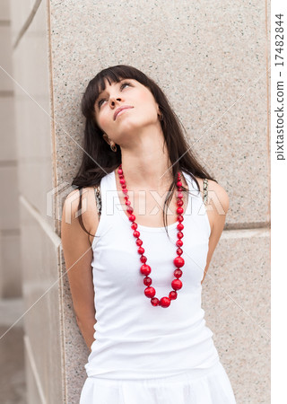 Attractive sad girl with red beads 17482844