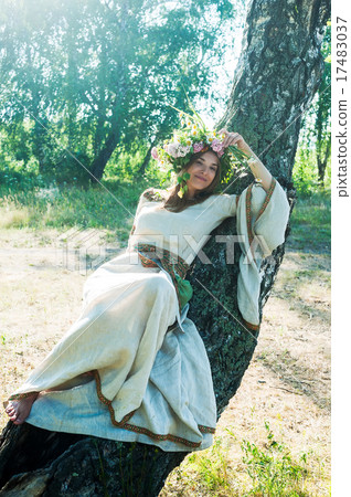 Young beautiful woman with flower wreath laying Young beautiful woman with flower wreath laying 17483037
