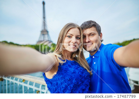 Beautiful young dating couple in Paris making selfie 17487799
