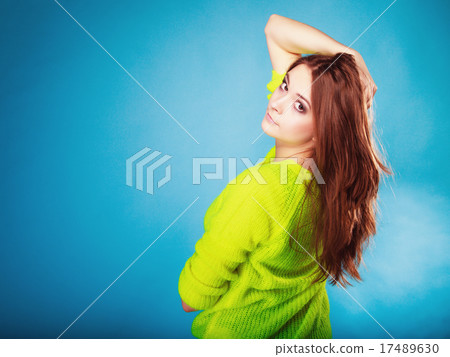 Portrait teen girl in vivid colour sweater on blue Portrait teen girl in vivid colour sweater on blue 17489630