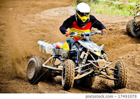 quad rider in championship race quad rider in championship race 17491078