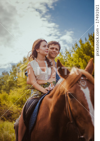 Young beautiful couple  with a horse. Filtered.  17491921