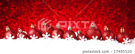 many christmas balls in the snow 17495520