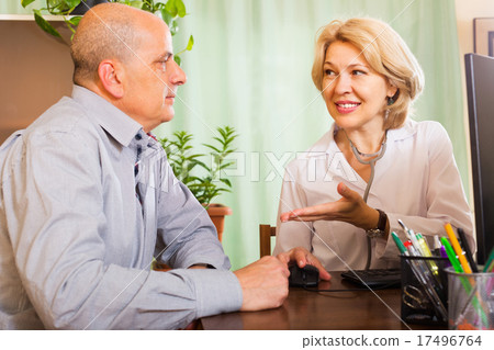 Doctor discharging patient from hospital Doctor discharging patient from hospital 17496764