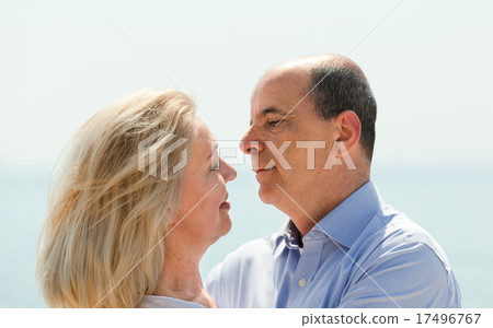 aged lovers laughting outdoor on seaside aged lovers laughting outdoor on seaside 17496767