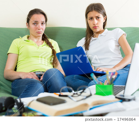 Sad students studying at home 17496864