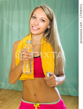 Girl with towel and bottle of water Girl with towel and bottle of water 17496931