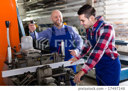 Two workmen in PVC shop 17497148