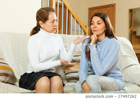 Mature mother with teen daughter having conversation 17497262