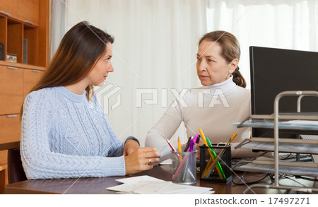 Employee interviewing young woman Employee interviewing young woman 17497271