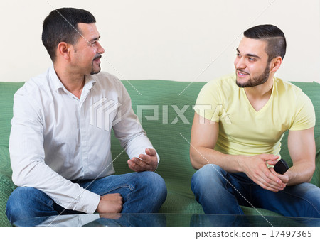 Two cheerful men at home 17497365
