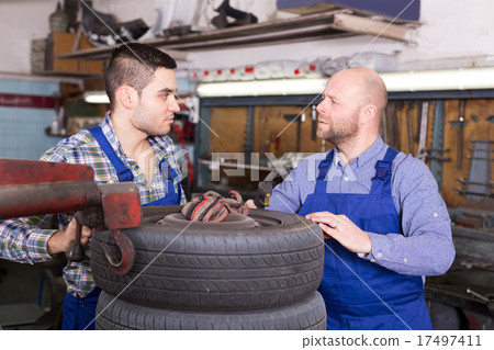 car mechanics working at carshop car mechanics working at carshop 17497411