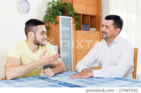 Two men talk 17497430