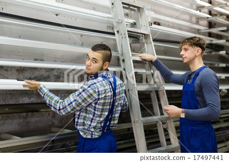 workers choosing window profiles workers choosing window profiles 17497441