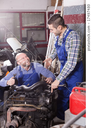 car mechanics working at carshop car mechanics working at carshop 17497480
