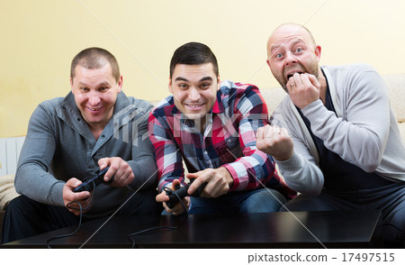 Friends relaxing with video game Friends relaxing with video game 17497515