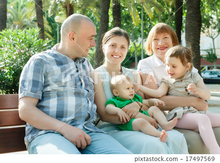 multigeneration family of five in sunny day 17497569