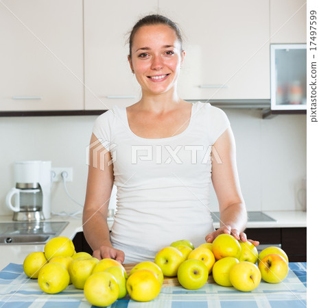 woman cooking dish from apples 17497599