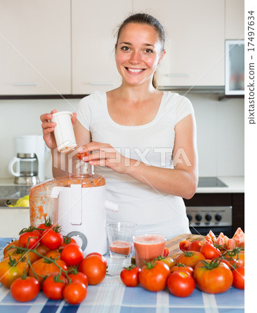 Girl preparing fresh juice in kitchen 17497634