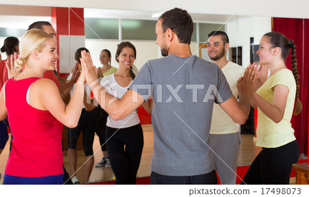 Group of people dancing salsa in studio Group of people dancing salsa in studio 17498073