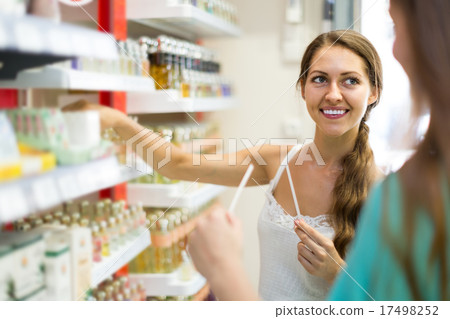 girl chooses perfume in the shop 17498252