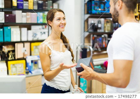 Customer paying for purchases 17498277